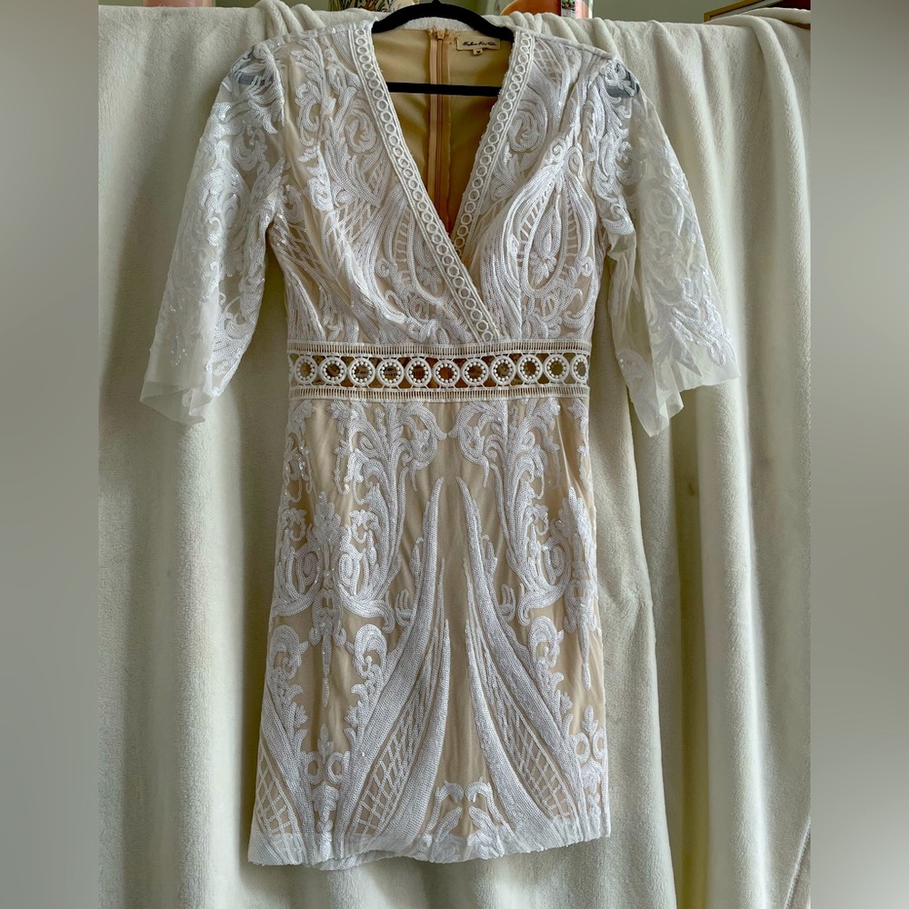 Brand new size M dress. Lots of detail with beading and sequins.